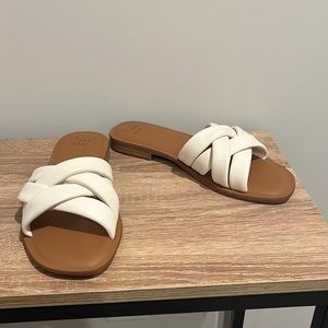 A new day size 8 flats. Worn once. White and tan.